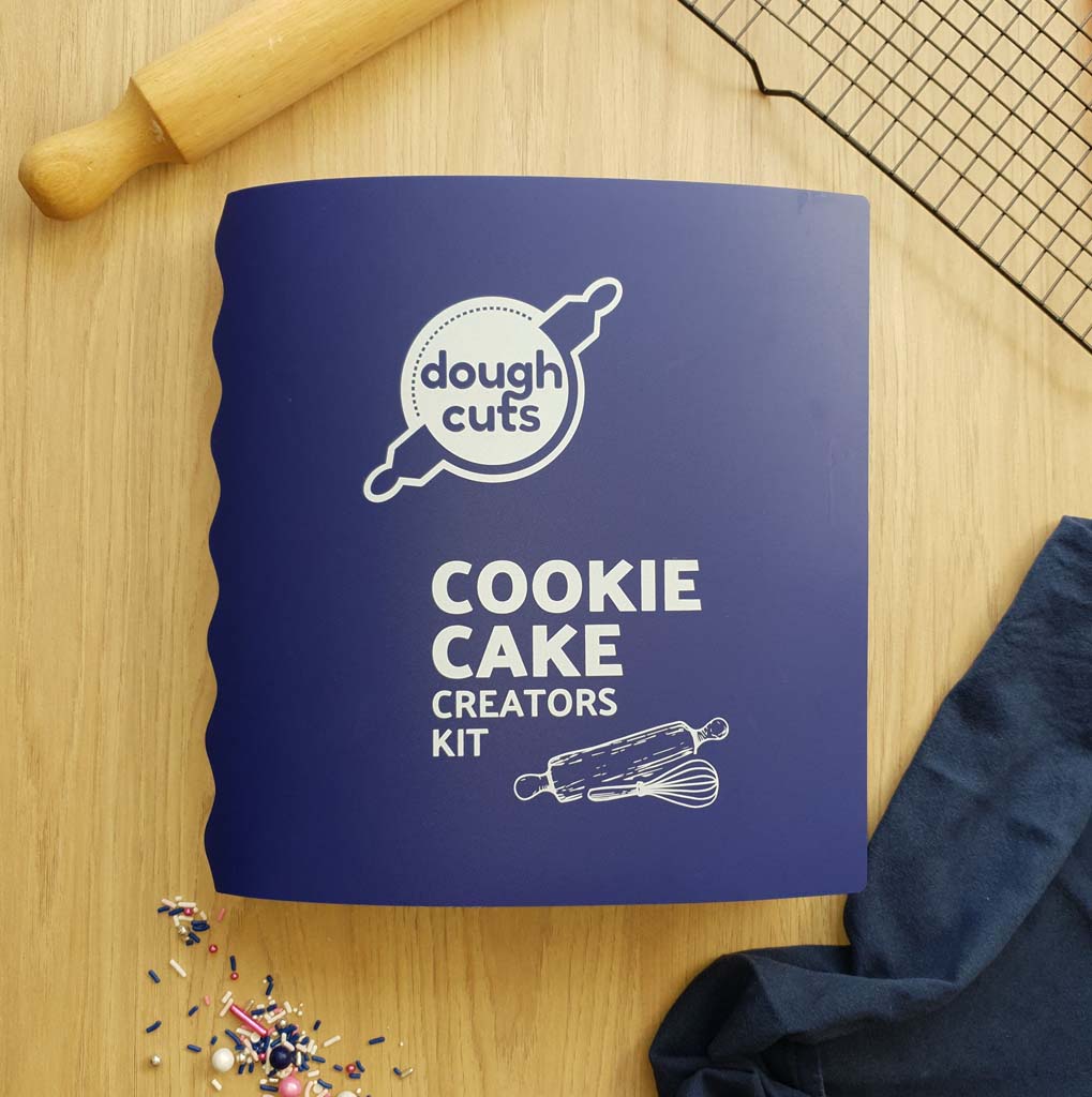 Image of cookie cake creators kit binder which includes 9 resusable number baking stencils or templates to make number cakes, number cookie cakes and cream tarts.